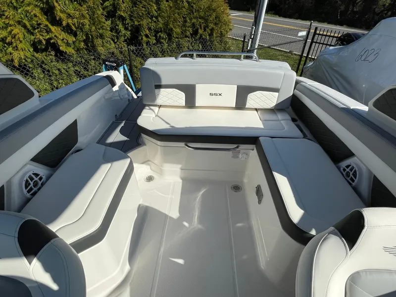 Slide: The Image of 2025 Chaparral 267 SSX boat interior with spacious seating and modern design. - 39