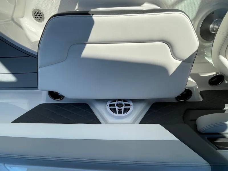 Slide: The Image of 2025 Chaparral 267 SSX boat interior with sleek seating and integrated speaker system. - 41