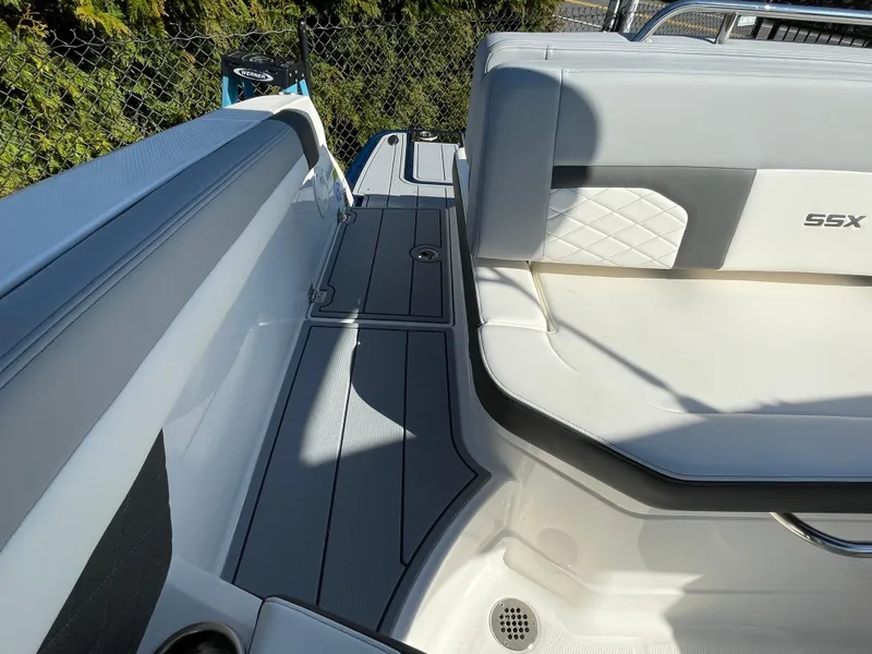 Slide: The Image of 2025 Chaparral 267 SSX boat interior with sleek seating and modern design. - 44