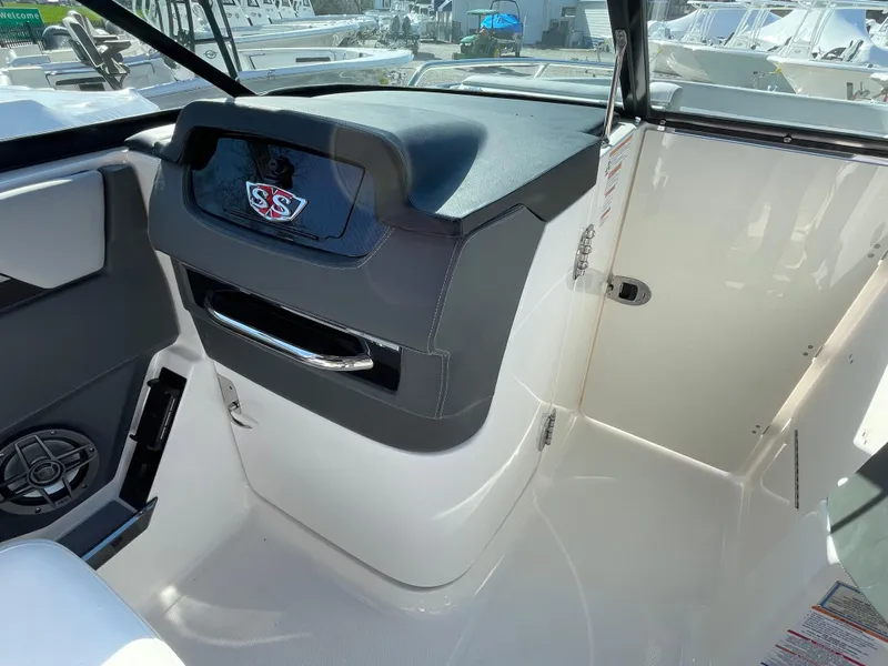 Slide: The Image of 2025 Chaparral 267 SSX boat interior with sleek dashboard and modern design. - 21