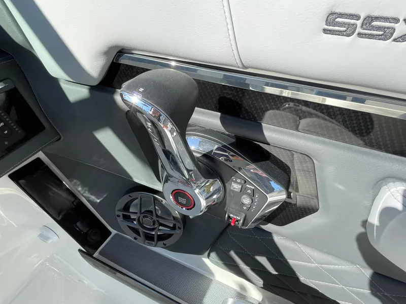 Slide: The Image of Throttle control of 2025 Chaparral 267 SSX boat, featuring sleek chrome design. - 34