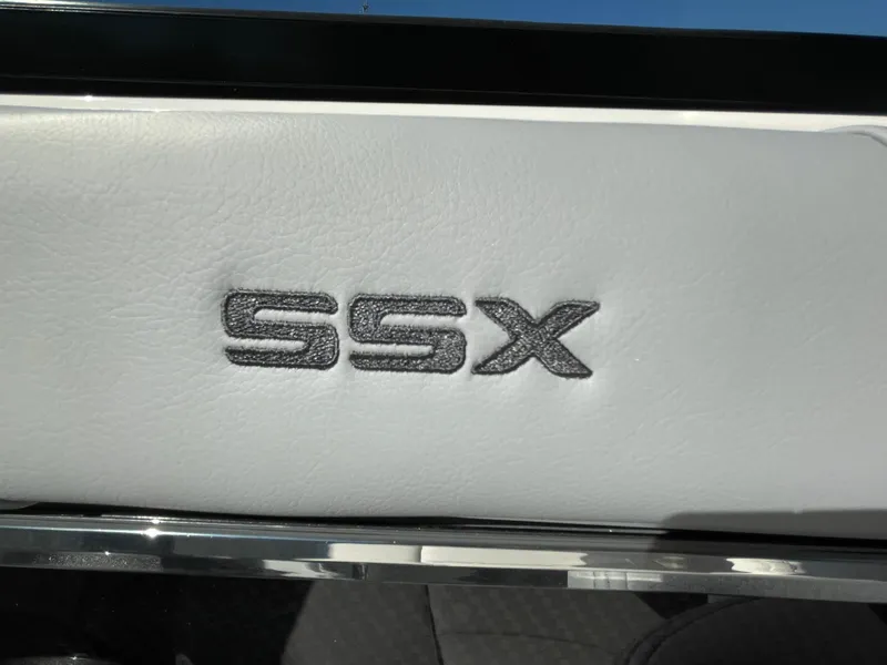 Slide: The Image of 2025 Chaparral 267 SSX logo on white leather interior. - 35