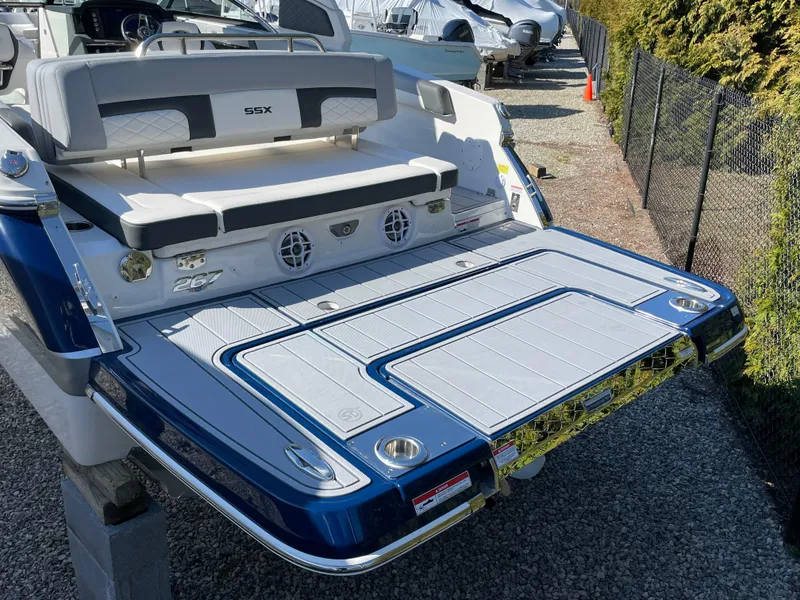 Slide: The Image of 2025 Chaparral 267 SSX boat with spacious swim platform and sleek design. - 4