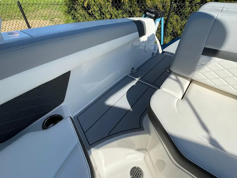 Slide: The Image of 2025 Chaparral 267 SSX boat interior with sleek seating and modern design. - 43