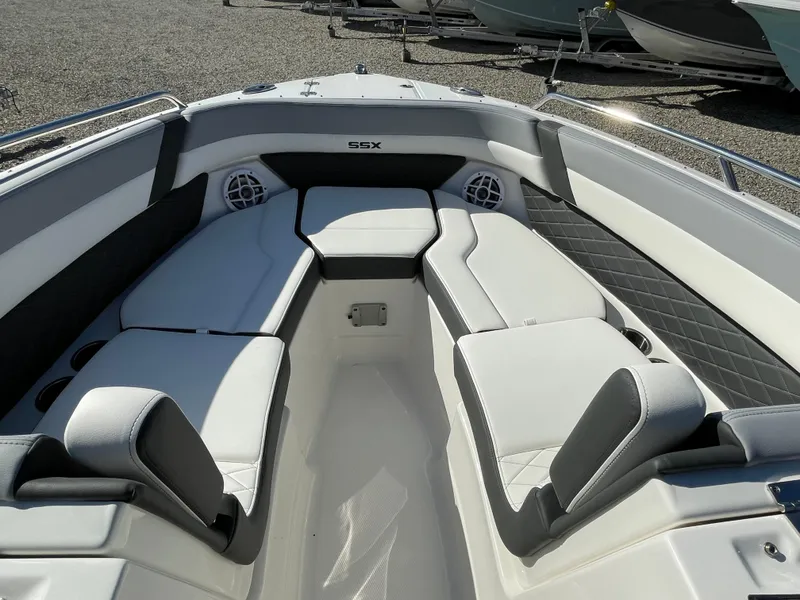 Slide: The Image of 2025 Chaparral 267 SSX boat interior with luxurious seating and modern design. - 7