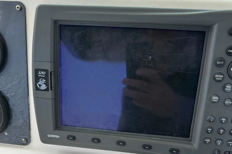 Slide: The Image of Garmin GPS device on 2006 Robalo R240 Center Console boat dashboard. - 10