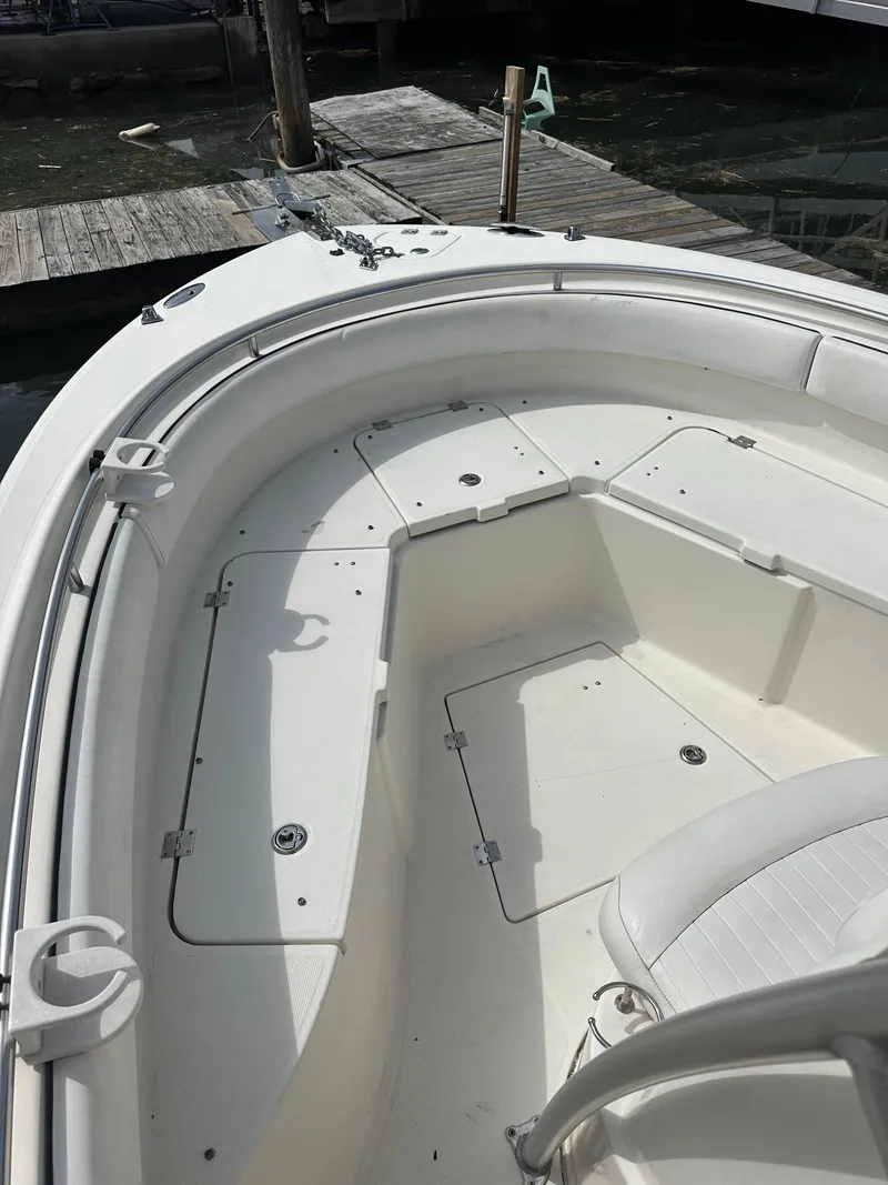 Slide: The Image of 2006 Robalo R240 Center Console boat with spacious seating and storage. - 3