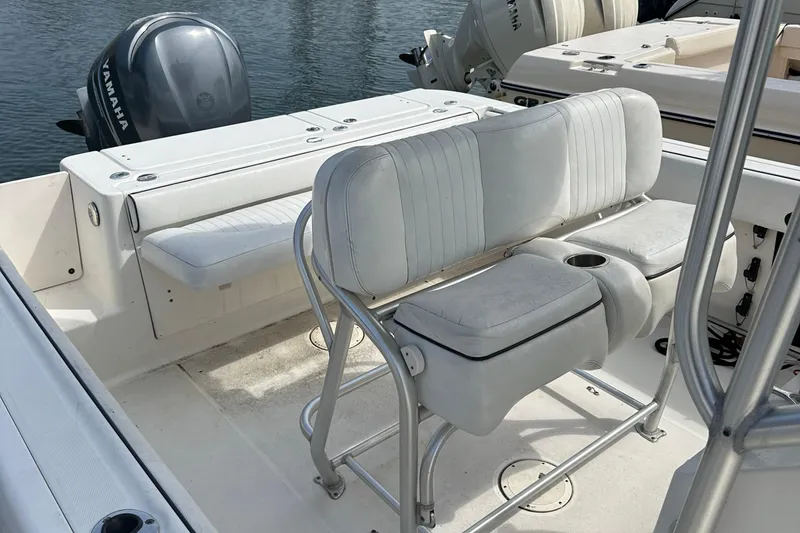 Slide: The Image of 2006 Robalo R240 Center Console boat interior with seating and Yamaha outboard motor. - 6