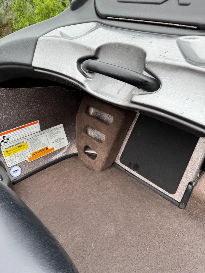 Slide: The Image of 2012 Skeeter ZX 21 boat interior with control panel and storage compartment. - 5