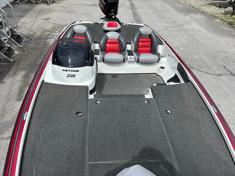 Slide: The Image of 2011 Nitro Z-8 boat with red and gray seating, spacious deck. - 10