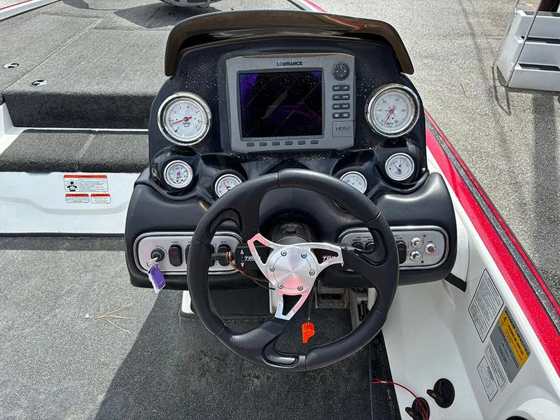 Slide: The Image of Steering console of a 2011 Nitro Z-8 boat with gauges and navigation system. - 14
