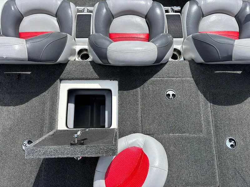 Slide: The Image of 2011 Nitro Z-8 boat interior with gray and red seats, open storage compartment. - 16