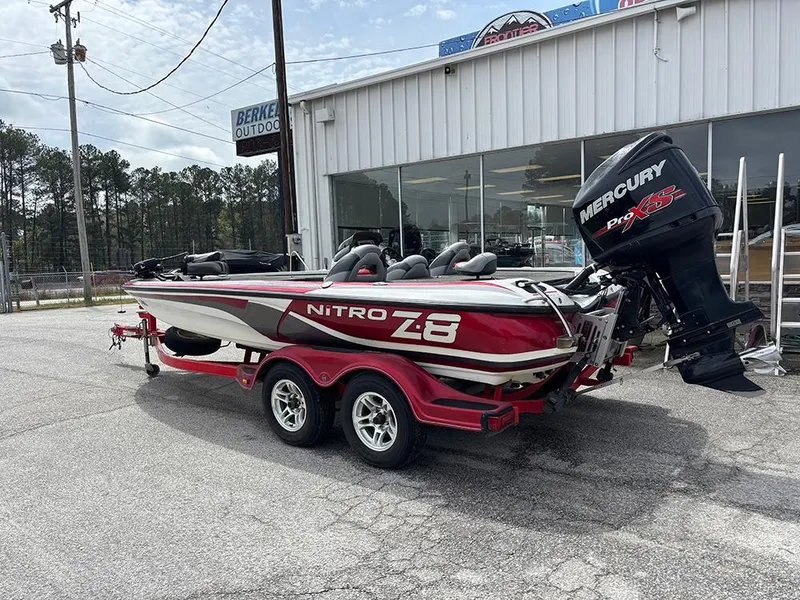 Slide: The Image of 2011 Nitro Z-8 boat with Mercury Pro XS engine, parked outside a dealership. - 2
