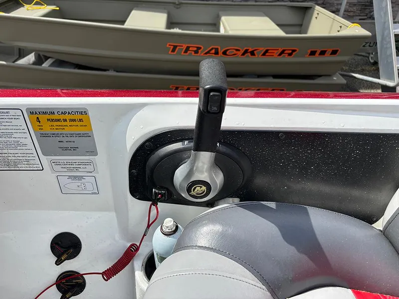 Slide: The Image of Boat control panel of a 2011 Nitro Z-8 with Tracker boat in background. - 21