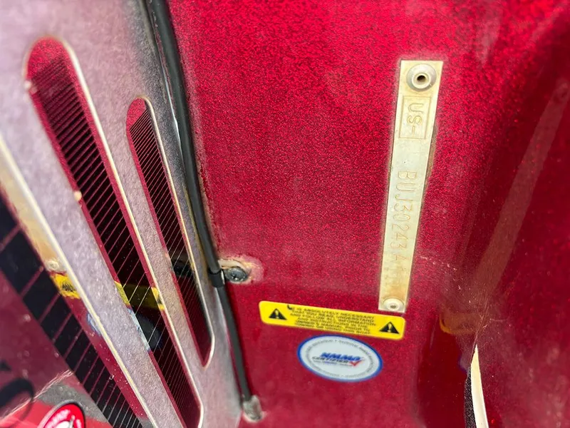 Slide: The Image of Red Nitro Z-8 boat interior with identification plate and warning labels, 2011 model. - 23