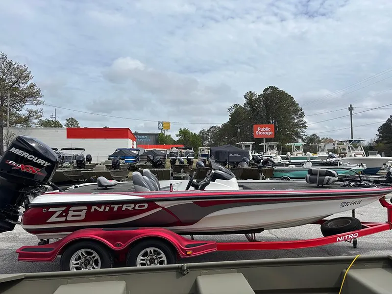 Slide: The Image of 2011 Nitro Z-8 boat on trailer, parked outdoors near storage facility. - 5