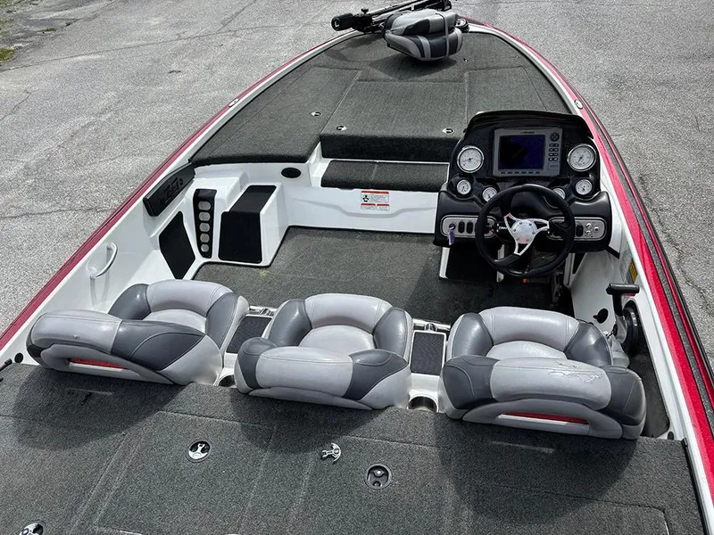 Slide: The Image of 2011 Nitro Z-8 boat interior with steering console and cushioned seating. - 8