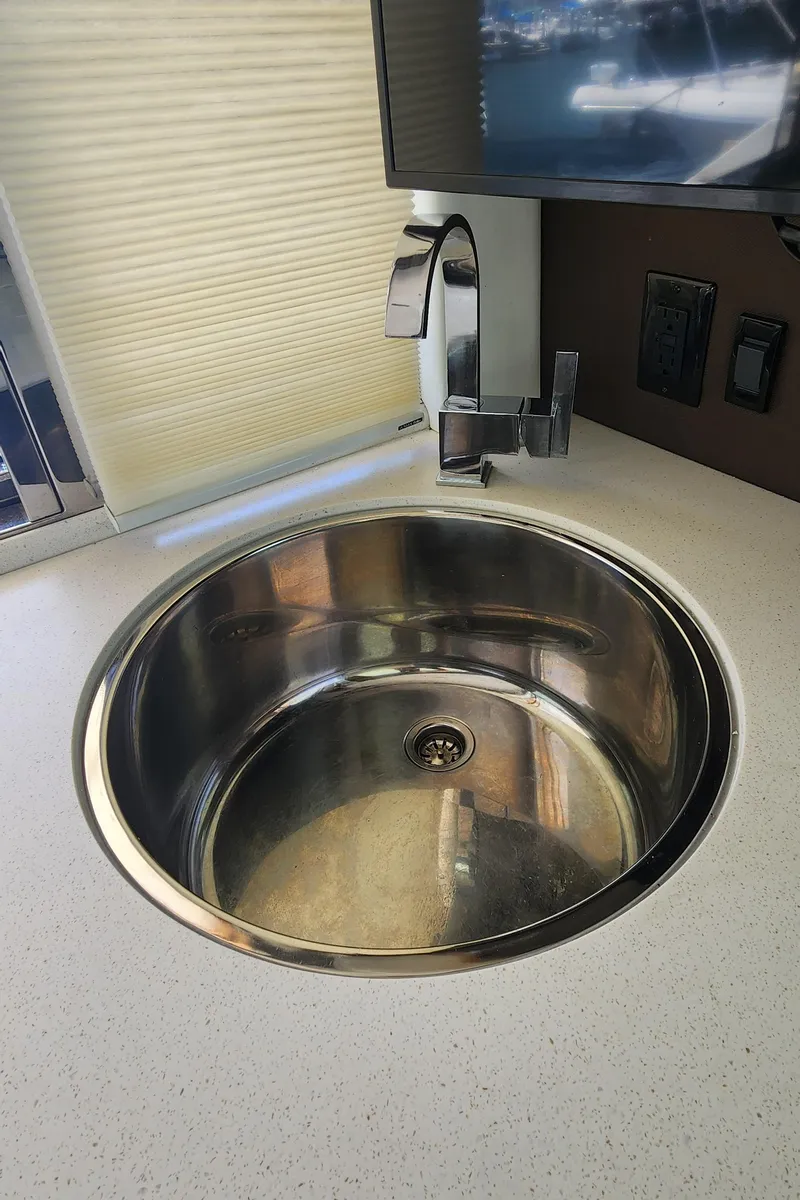 Slide: The Image of Stainless steel sink in 2014 Cruisers Cantius yacht kitchen. - 22