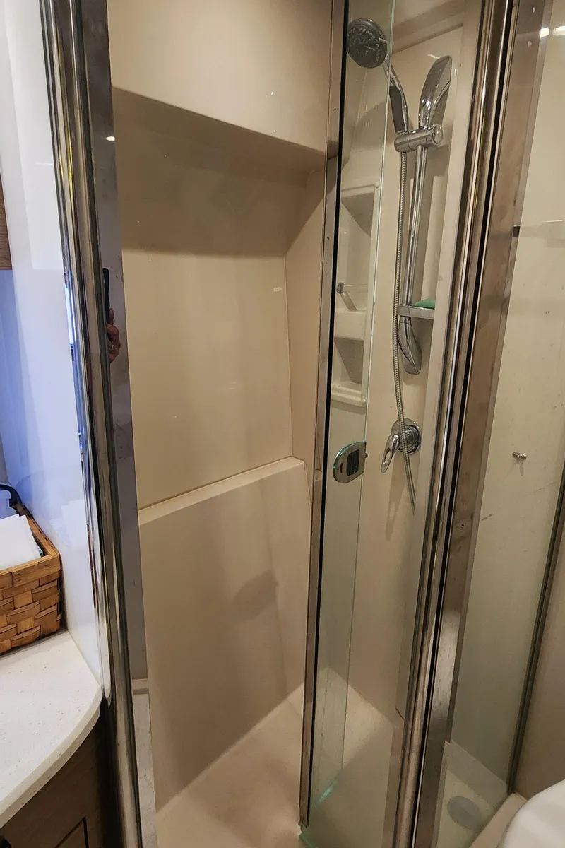 Slide: The Image of Shower area in 2014 Cruisers Cantius yacht with modern fixtures and glass door. - 38