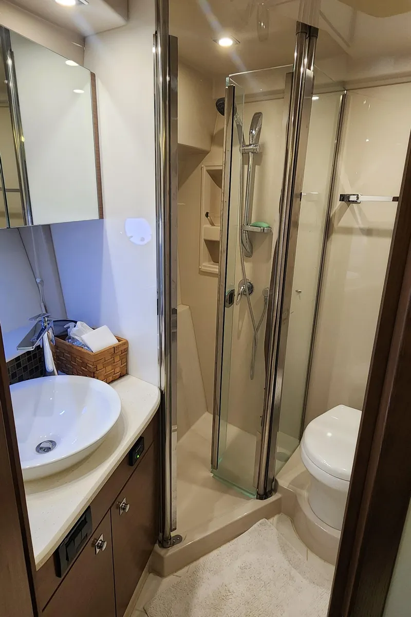 Slide: The Image of Luxurious 2014 Cruisers Cantius yacht bathroom with modern fixtures and glass shower. - 40