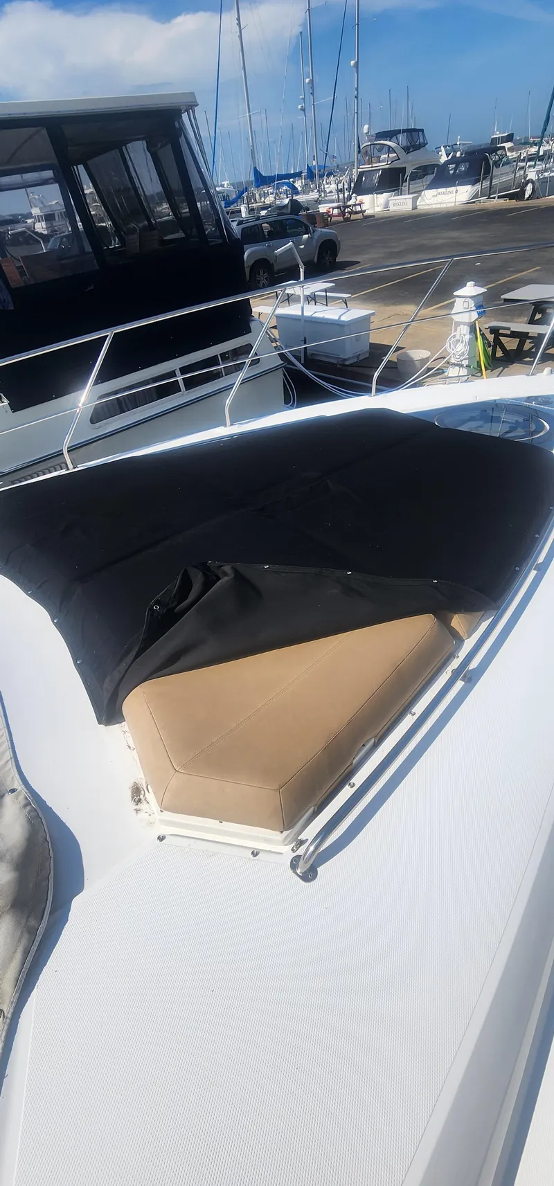 Slide: The Image of 2014 Cruisers Cantius yacht with covered bow seating at a marina. - 15