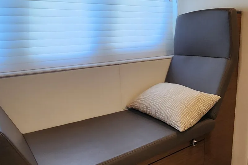 Slide: The Image of Luxurious seating area in 2014 Cruisers Cantius yacht with cushion and window blinds. - 29