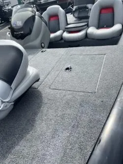 Slide: The Image of 2017 Tracker 175 Pro Team boat interior with gray carpet and seating. - 5