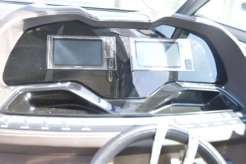 Slide: The Image of Dashboard of a 2018 Cobalt R35 boat with dual digital displays. - 10
