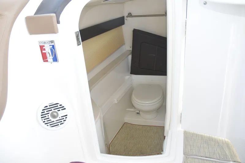 Slide: The Image of 2018 Cobalt R35 boat interior bathroom with toilet and speaker. - 15