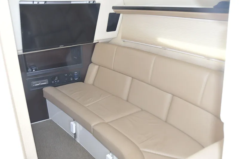 Slide: The Image of 2018 Cobalt R35 interior with beige leather seating and mounted TV. - 16