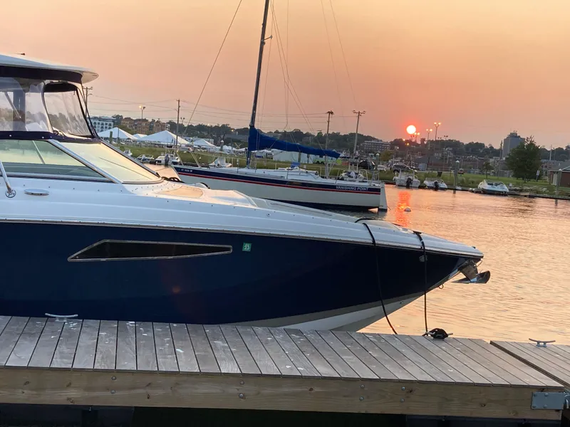 Slide: The Image of Cobalt R35 boat docked at sunset, serene waterfront view, 2018 model. - 17