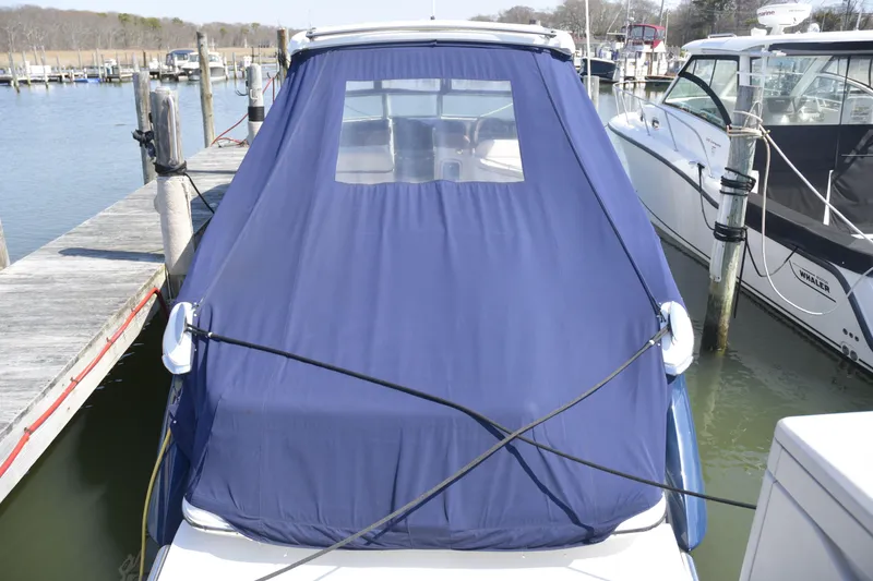 Slide: The Image of Blue-covered 2018 Cobalt R35 boat docked at marina. - 23
