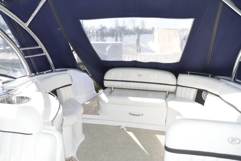 Slide: The Image of Interior of 2018 Cobalt R35 boat with white seating and blue canopy. - 7