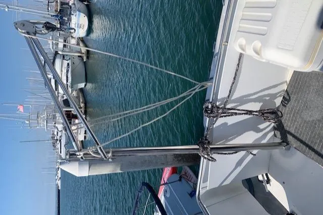Slide: The Image of 1992 Carver 33 Aft Cabin boat docked at marina with visible rigging. - 35