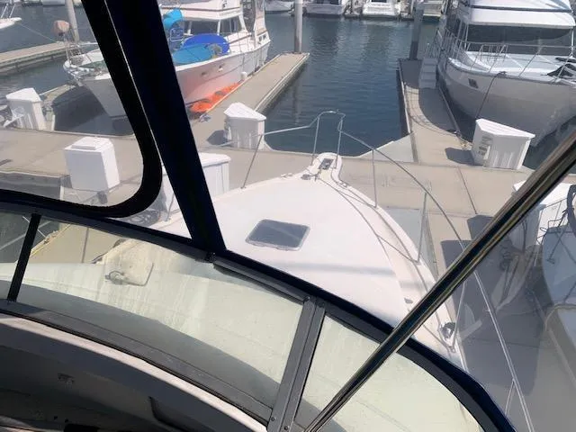 Slide: The Image of 1992 Carver 33 Aft Cabin yacht docked at marina, viewed from helm. - 8