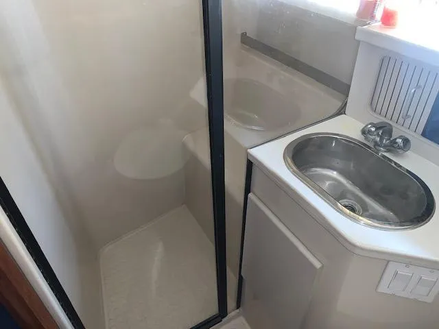 Slide: The Image of 1992 Carver 33 Aft Cabin bathroom with shower and sink. - 19