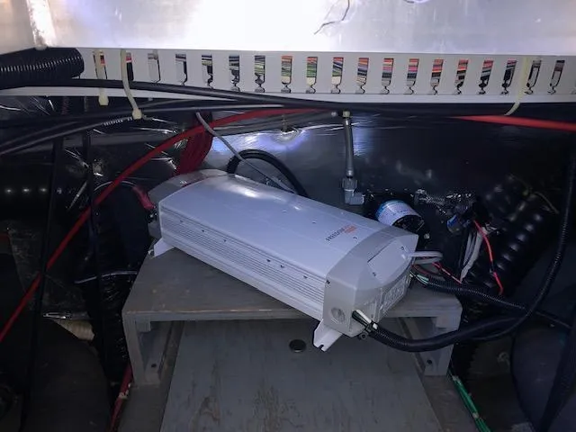 Slide: The Image of Electrical system inside 1992 Carver 33 Aft Cabin boat, featuring wiring and components. - 25