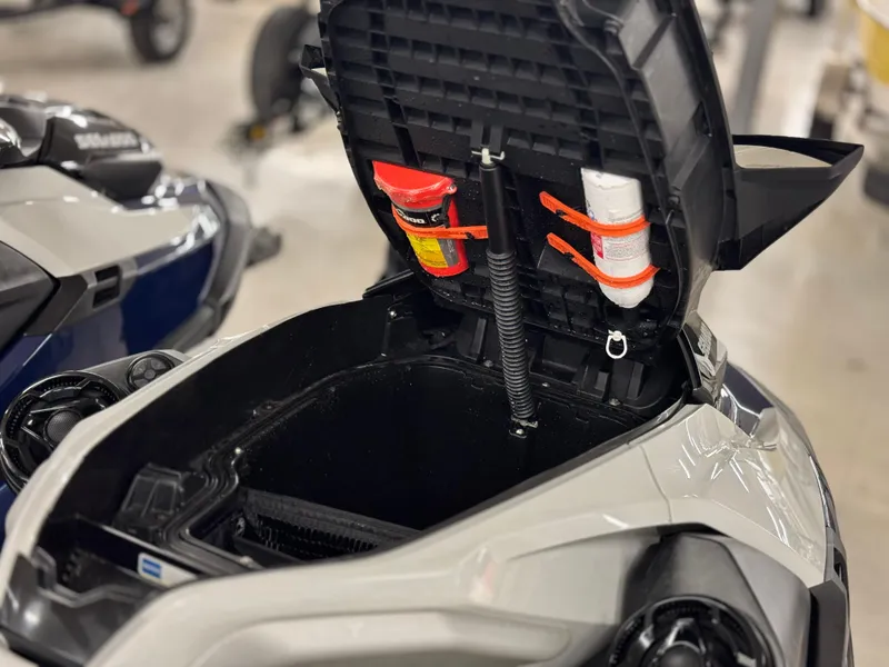 Slide: The Image of 2023 Sea-Doo GTX LTD 300 storage compartment with safety gear and accessories. - 13