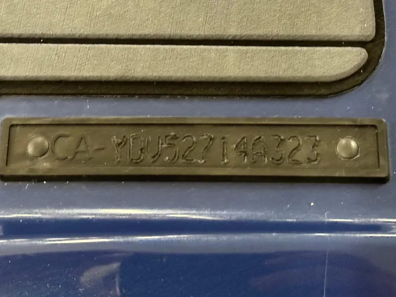 Slide: The Image of 2023 Sea-Doo GTX LTD 300 identification plate with serial number on blue surface. - 17