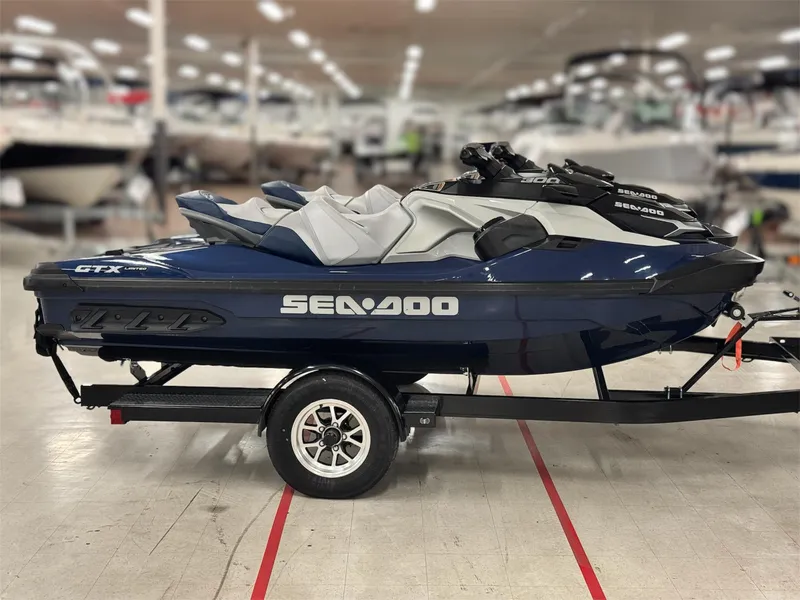 Slide: The Image of 2023 Sea-Doo GTX LTD 300 jet ski on trailer in showroom. - 19