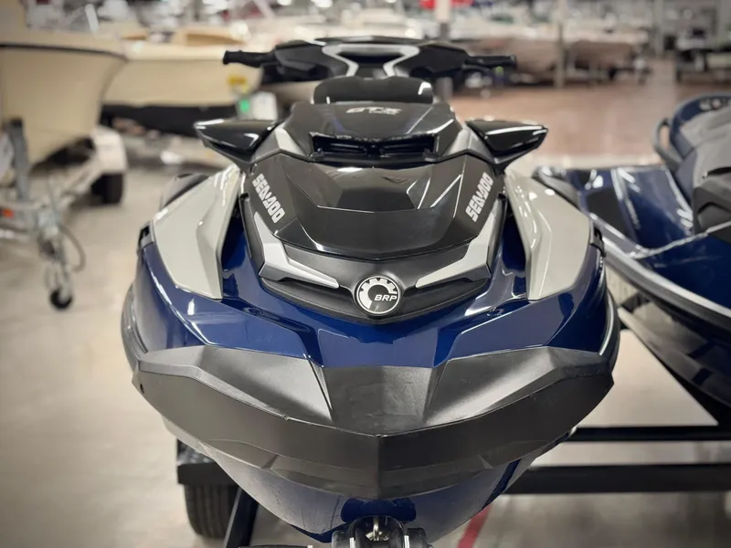 Slide: The Image of 2023 Sea-Doo GTX LTD 300 jet ski in showroom, front view. - 2