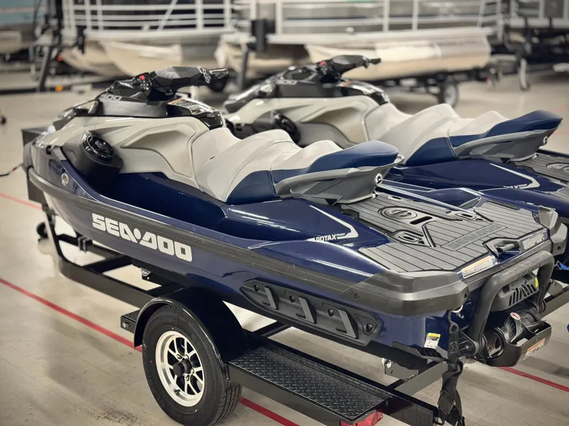 Slide: The Image of 2023 Sea-Doo GTX LTD 300 jet skis on a trailer in a showroom. - 21