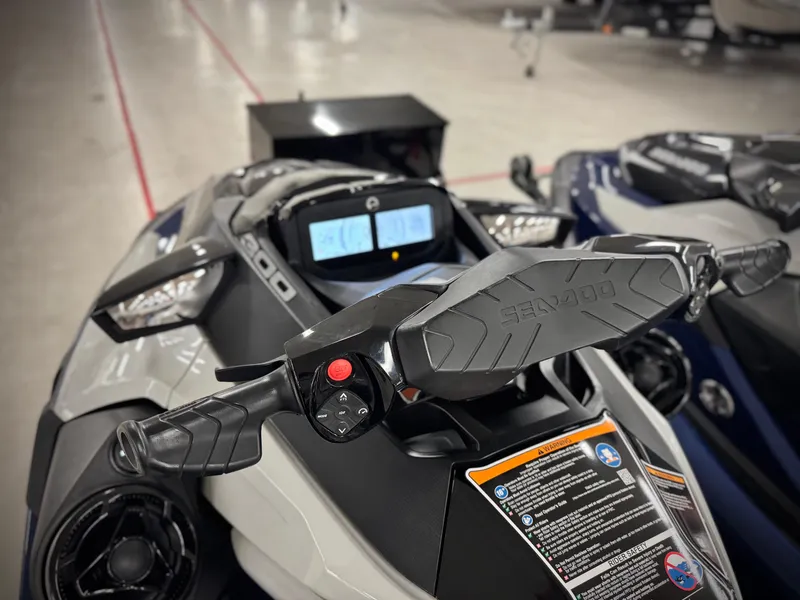 Slide: The Image of 2023 Sea-Doo GTX LTD 300 dashboard and handlebars in a showroom setting. - 28