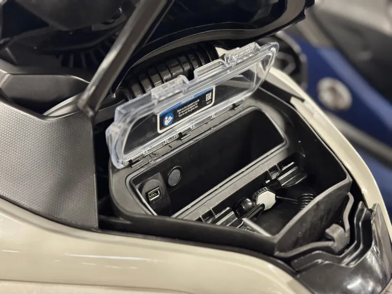 Slide: The Image of 2023 Sea-Doo GTX LTD 300 storage compartment with USB port and accessories. - 30