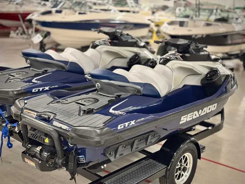 Slide: The Image of 2023 Sea-Doo GTX LTD 300 jet skis on trailer in showroom. - 5