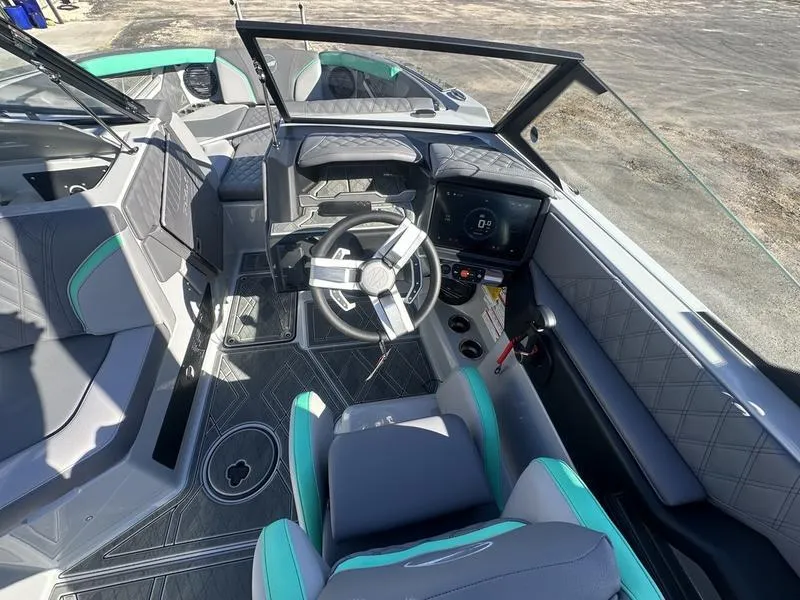Slide: The Image of 2025 Tigé 24RZX boat interior with modern steering and seating design. - 1