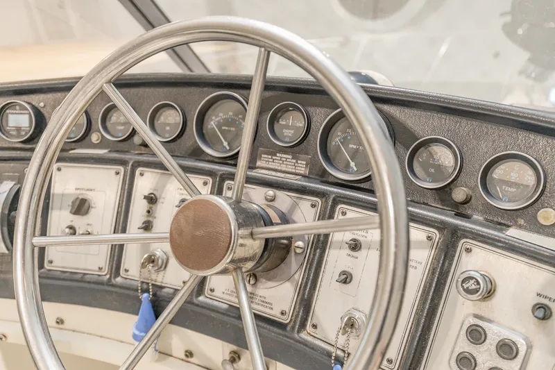 Slide: The Image of Steering wheel and dashboard of 1987 Carver 3697 Mariner boat. - 39