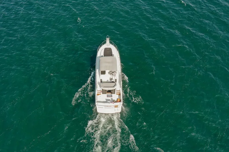 Slide: The Image of Aerial view of 1987 Carver 3697 Mariner cruising on open water. - 7