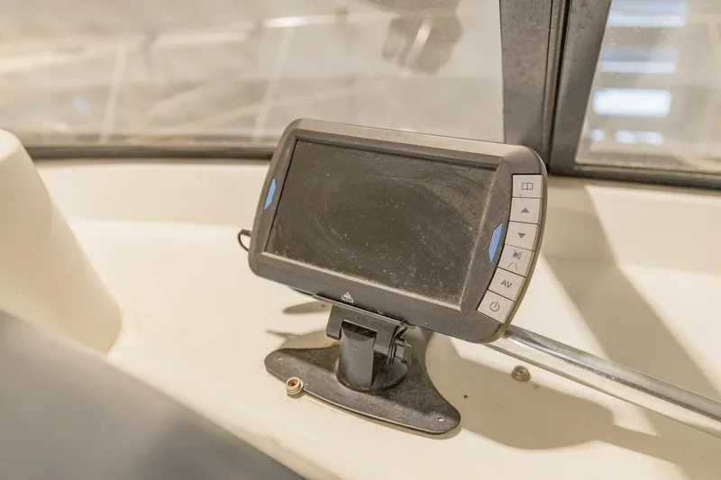 Slide: The Image of Dashboard of 1987 Carver 3697 Mariner with mounted navigation device. - 40