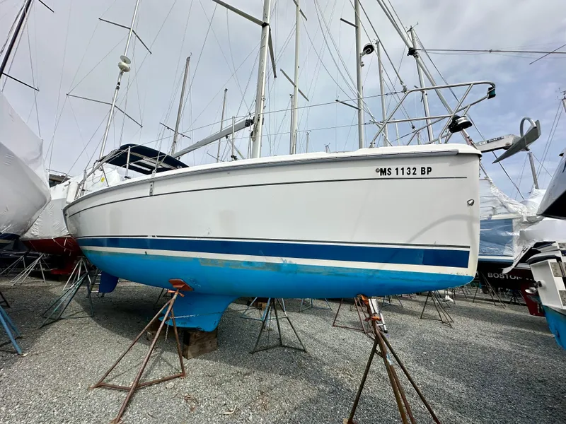 Slide: The Image of Interior of 2006 Hunter 31 sailboat with kitchen and seating area. - 2